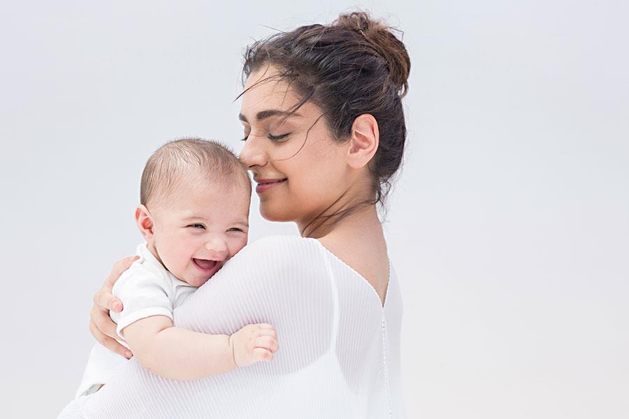Mother hugs Baby