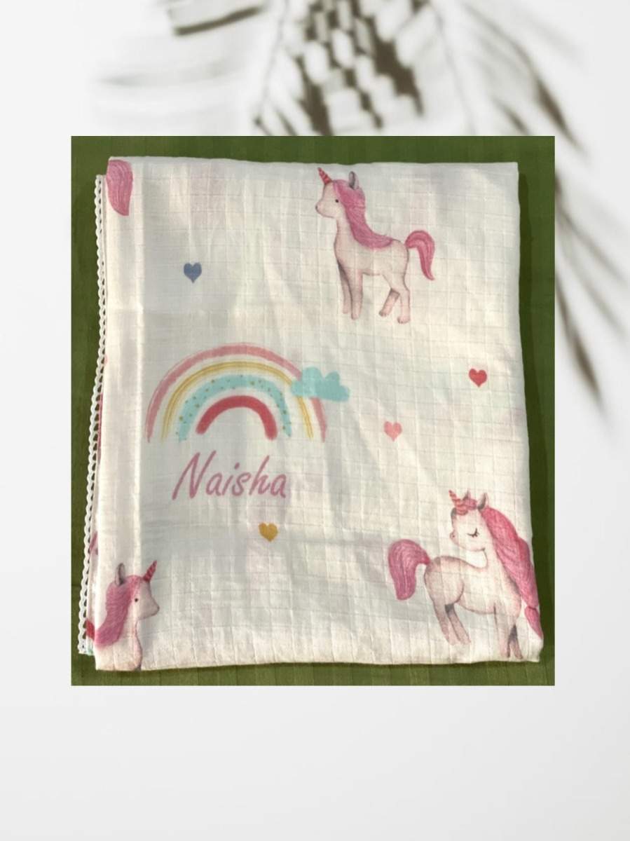 Unicorns and rainbows customised swaddle