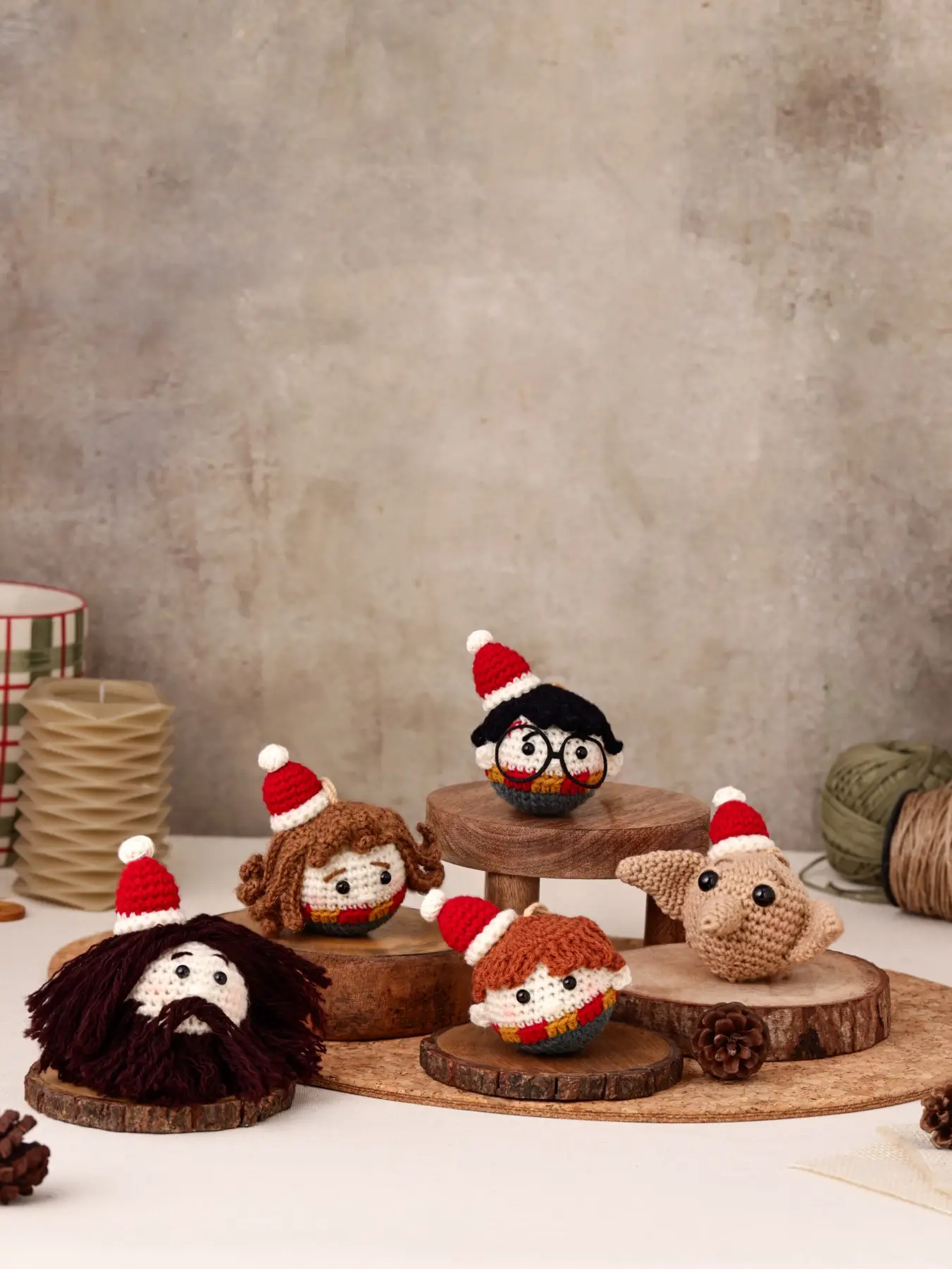 Set of five handmade crochet character ornaments in Santa hats